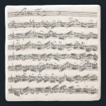 Bach Cello Suite Music Manuscript Stone Coaster<br><div class="desc">The first page from J.S. Bach's second Suite for cello solo is displayed on this natural stone coaster, reproduced from Anna Magdalena Bach's handwritten copy. When not doing service on the counter or table, this item is simply a lovely object to have on view in a cellist's home or studio;...</div>