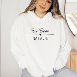 Bachelorette Party Team Bride Personalised Bridal Hoodie<br><div class="desc">Introducing our Team Bride Personalised Bridal Hoodie – the perfect addition to your bachelorette party festivities! Make a statement with this stylish and comfortable hoodie that boasts key attributes tailored to enhance your celebration. Celebrate in style with our eye-catching bachelorette party shirts! The hoodie is designed to be the ultimate...</div>