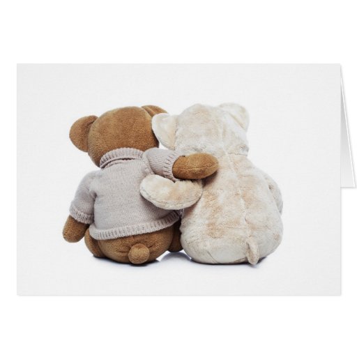 Image of Back view of two Teddy bears hugging each other
