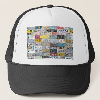 Background filled with various license plates.JPG Trucker Hat