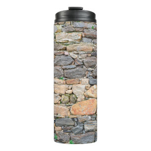 background of stone wall texture photoabandoned, a thermal tumbler
