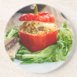 Baked stuffed peppers with meat sauce and cheese coaster