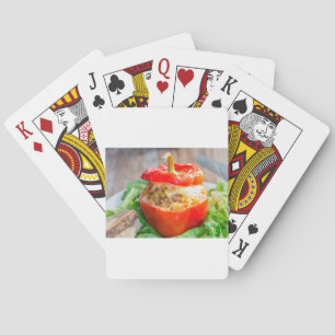Baked stuffed peppers with meat sauce and cheese playing cards