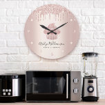 Bakery Cupcake Pastry Chef Rose Gold Glitter Drips Large Clock<br><div class="desc">Make a stylish impression with this elegant, sophisticated, simple, and modern custom name wall clock. A sparkly, rose gold cupcake, script handwritten typography and glitter drips overlay a faux metallic rose gold ombre background. Personalise with your full name, business, or other info. Your choice of a round or square clock...</div>