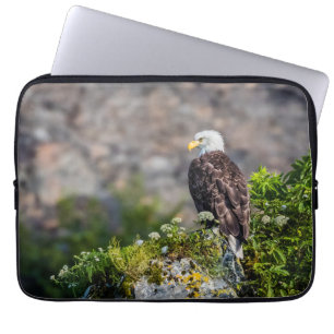 Bald eagle sitting on the rock laptop sleeve