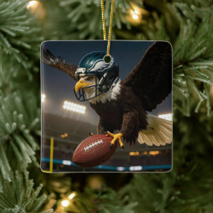 Bald Eagle With a Football and Helmet Ceramic Ornament