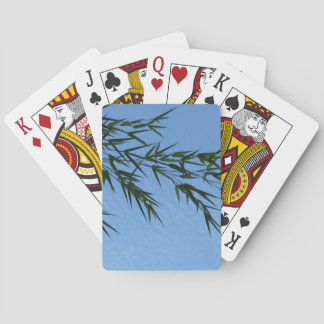 bamboo against a cloudy sky playing cards