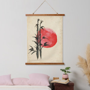 Bamboo in front of a red sun hanging tapestry