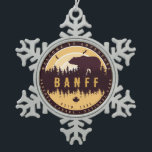 Banff Canada Rocky Mountains Vintage Camping Snowflake Pewter Christmas Ornament<br><div class="desc">Banff National Park design. The park is Canada’s first national park and is part of the Canadian Rocky Mountain Parks World Heritage. Banff National Park Canada Vintage design makes a great Christmas or Birthday gift for fans of Canadian National Park. This design is a perfect gift for skiing lovers in...</div>