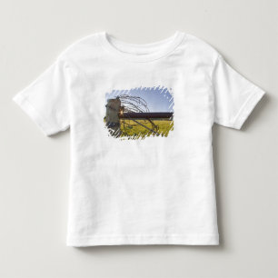 Barbed wire rolled up on fencerow near toddler T-Shirt