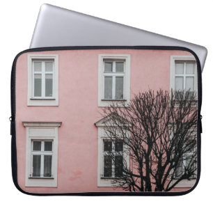 BARE TREE IN FRONT OF PINK BUILDING LAPTOP SLEEVE