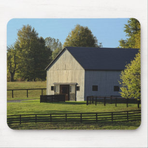 Barn on thoroughbred horse farm at sunrise, mouse mat