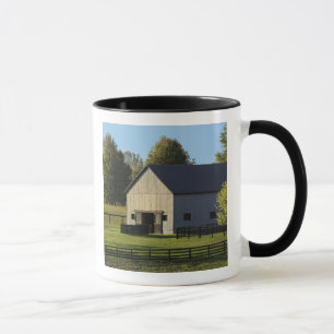 Barn on thoroughbred horse farm at sunrise, mug