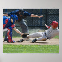 Baseball player sliding into home plate