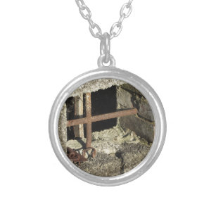 Basement window with rusty iron bars silver plated necklace