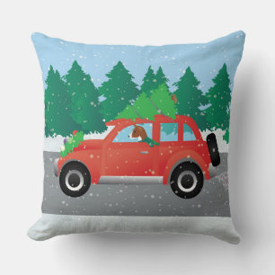 Basenji Dog Driving a  Red Car with Christmas Tree Cushion