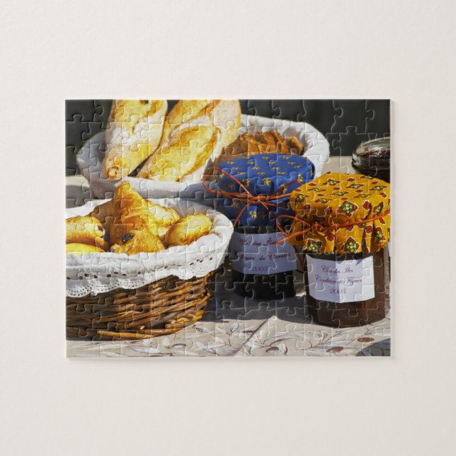 Basket with croissants and chocolate breads. jigsaw puzzle (Horizontal)