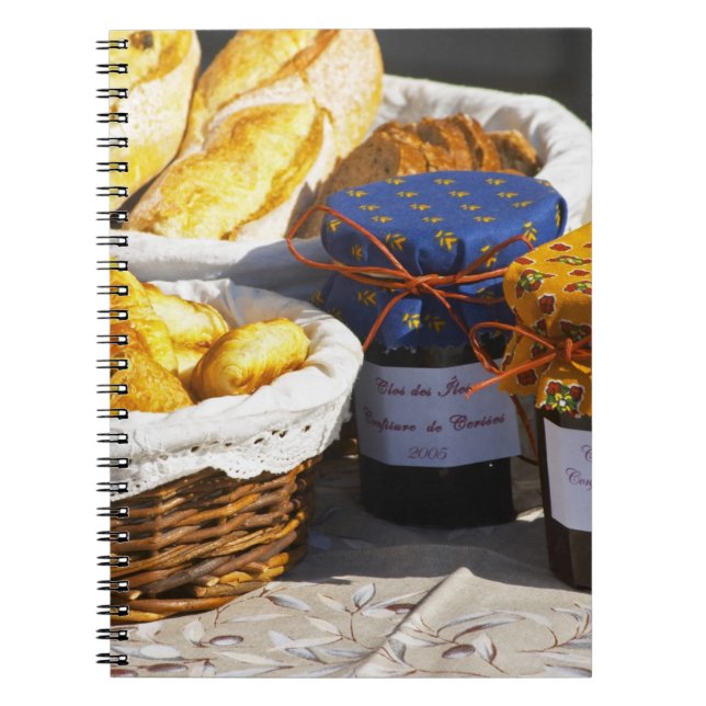 Basket with croissants and chocolate breads. notebook (Front)