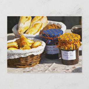 Basket with croissants and chocolate breads. postcard