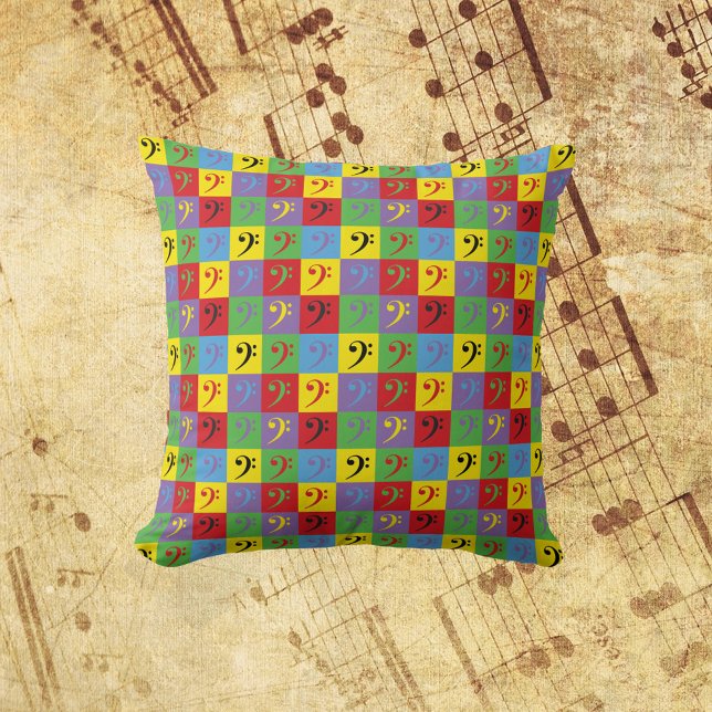 Bass Clef Music Pop Art Colourful Pattern Cushion (A throw pillow with a pop art pattern of bass clef music symbols.)