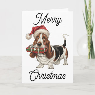 Basset Hound in Santa hat present in mouth Card