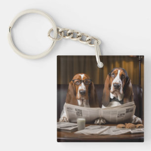 Basset hounds reading the newspaper key ring