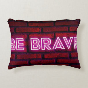 Be brave inspirational quote neon effect text on o decorative cushion