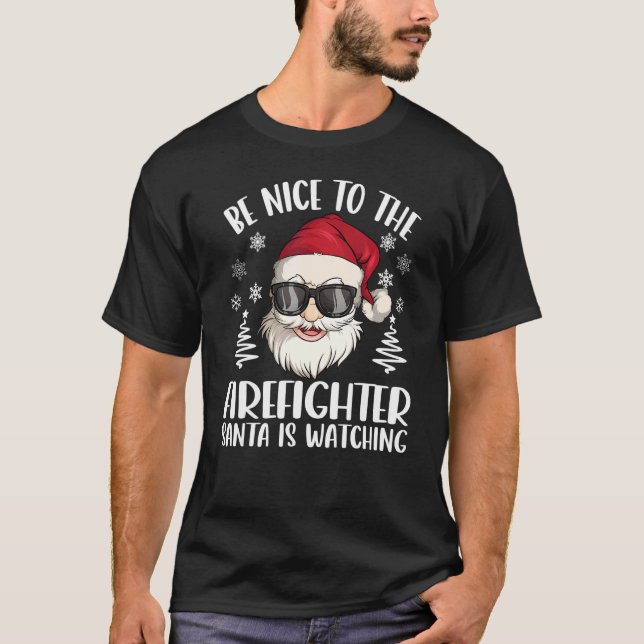 Be Nice To The Firefighter Santa Is Watching Chris T-Shirt (Front)