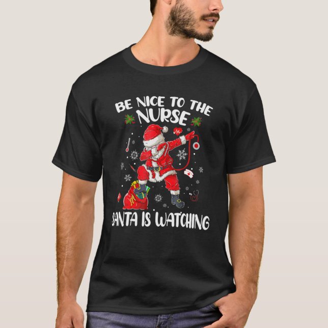 Be Nice To The Nurse Santa Is Watching Nursing Chr T-Shirt (Front)