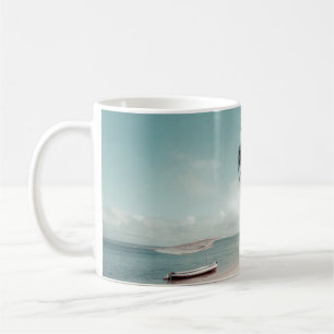 Beach beside coconut palm tree coffee mug