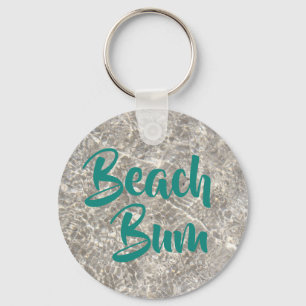 Beach bum water on beach sand key ring