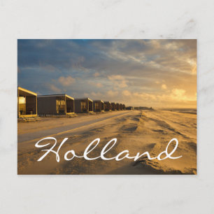 Beach cabins at sunset at the dutch coast postcard