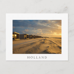 Beach cabins at sunset at the dutch coast postcard