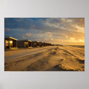 Beach cabins at sunset at the dutch coast poster