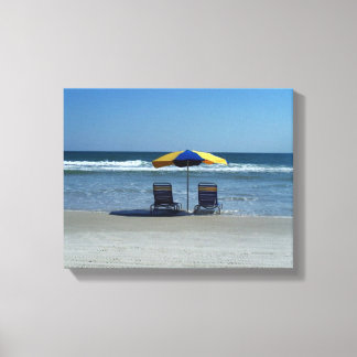 Beach Chairs on The Shoreline Canvas Print