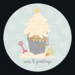 Beach Christmas Sand Pail Classic Round Sticker<br><div class="desc">Bring the warmth and charm of a coastal Christmas to your holiday greetings with our Beachy Sand Pail Stickers! Perfect for beach lovers and those who cherish the sea. This design showcases a delightful illustration of a sand pail filled with sand shaped into a Christmas tree. Adorned with tiny beach-themed...</div>