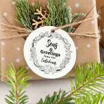 Beach Christmas Seas and Greetings Gift Stamp<br><div class="desc">Add a touch of coastal charm to your holiday greetings with our Seas & Greetings Seashell Rubber Stamp! This delightful stamp features a ring of beautifully detailed seashells encircling the text "Seas & Greetings from the, " leaving plenty of space for you to personalise it with your family name. It's...</div>