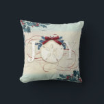 Beach Coastal Christmas Joy Sand Dollar Blue Holly Cushion<br><div class="desc">"Beach Coastal Christmas Joy Sand Dollar Holly with red glitter flourishes and a burgundy bow, throw pillow." Elegant watercolor design with a textured sand and sea background, holly in blue and red with the typography design, "JOY" in off white. Red glitter accents the calligraphy scrolls and a burgundy bow finishes...</div>