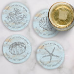 Beach House Vintage Sea Shells Coral Custom Coaster Set<br><div class="desc">Super cute set of coasters featuring vintage style sea graphics - a shell, sea urchin, starfish, and coral all set against a weathered blue wood background. Add two lines of custom text to personalise. Perfect for a beach house, vacation rental, nautical seaside cottage, beach wedding and more - great as...</div>