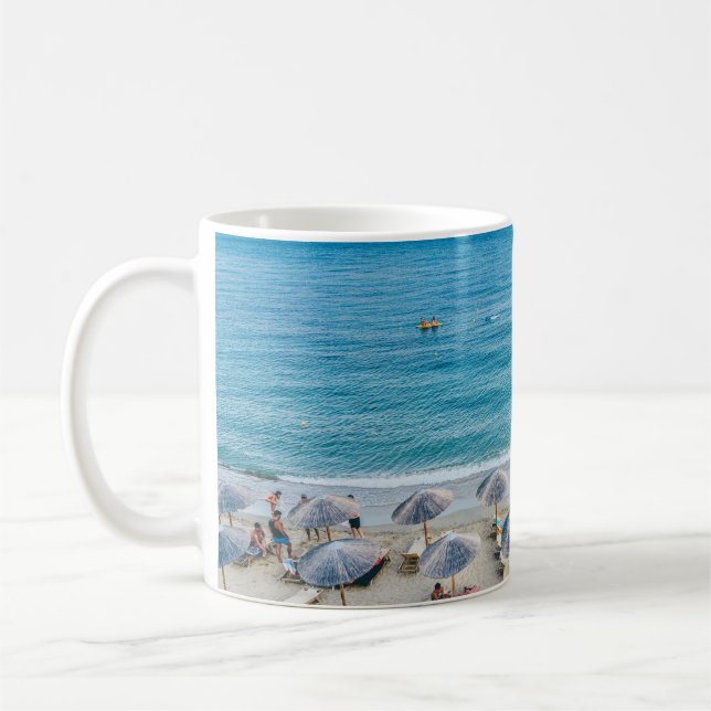 Beach lounge on seashore facing the sea coffee mug (Left)