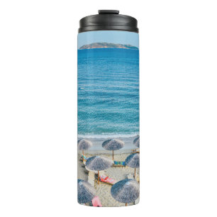 Beach lounge on seashore facing the sea thermal tumbler