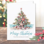 Beach Merry Christmas Tree Holiday Card<br><div class="desc">Happy Holidays! Share some coastal cheer with this folded holiday card featuring a festive Christmas tree made of seashells and topped with a starfish. The design is perfect for those who live in tropical places like Hawaii, Florida, or the Bahamas—or for anyone who loves the laid-back beach vibe during the...</div>