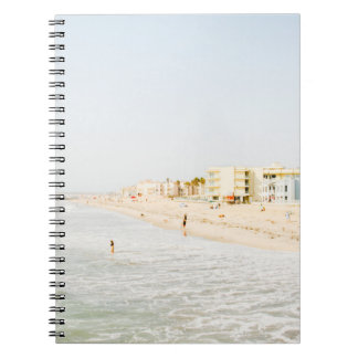 BEACH NEAR BUILDING AT DAYTIME NOTEBOOK