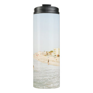 BEACH NEAR BUILDING AT DAYTIME THERMAL TUMBLER