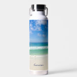 Beach Photography Blue Ocean Waves Personalised Water Bottle<br><div class="desc">This cool beach photography water bottle is perfect for a seaside restaurant or beachfront bar souvenir. A beautiful beach photograph taken in the ideal vacation destination of Destin, Florida. The gorgeous green waters of Sandestin wash up to the sandy seashore underneath serene blue skies to make the perfect scenic vacation...</div>