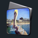 Beach Pier Pelican Bird Photo Sun Day Quote Script Laptop Sleeve<br><div class="desc">This happy pelican perched on a railing overlooking a California beach screams “vacation ready”. Drift back to the warm ocean breezes whenever you use this colourful photography neoprene laptop sleeve. This laptop sleeve comes in three sizes: 15", 13", and 10”. Makes a great gift for someone special! You can easily...</div>