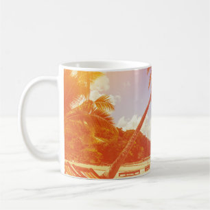 Beach scene, coconut tree, wooden bed. coffee mug