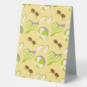 Beach vacay pattern with sunglasses and sun hat