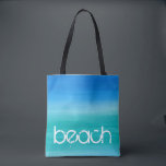 Beach Watercolor Ocean Blue Green Tote Bag<br><div class="desc">This beach design features distressed text on a watercolor ocean blue and green background. Click the customise button for options for modifying or adding text! Variations of this design, additional colours, as well as coordinating products are available in our shop, zazzle.com/store/doodlelulu. Contact us if you need this design applied to...</div>