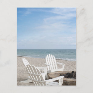 beachfront house with adirondack chairs and postcard